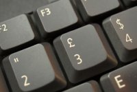 A pound sign on a grey keyboard